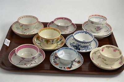 Lot 133 - A collection of nine early 19th century tea bowls and saucers including one Chinese example