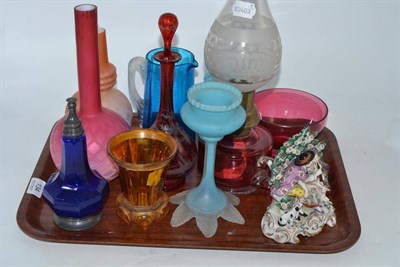 Lot 134 - A tray of decorative glass including pink satin glass bottle vase, cranberry oil lamp, ruby flashed