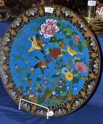 Lot 139 - A Meji period Japanese cloisonné charger decorated with birds in foliage, 46cm wide (losses)