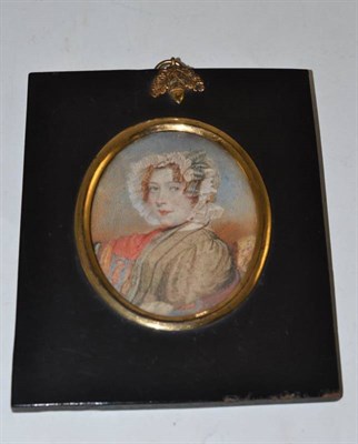 Lot 161 - A miniature, framed depicting a lady with bonnet