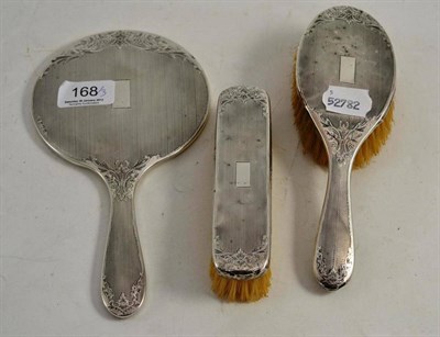 Lot 168 - A three piece silver brush set