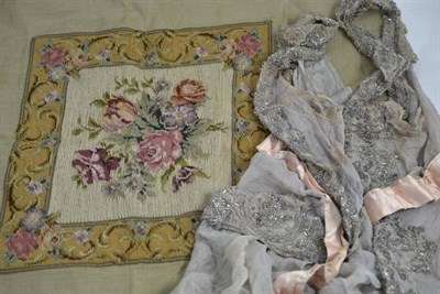 Lot 181 - A 19th century beadwork shawl and a needlework panel