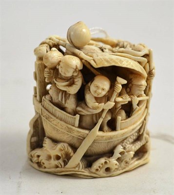 Lot 202 - Late 19th century carved ivory netsuke of figures sailing on a boat carved in high relief,...