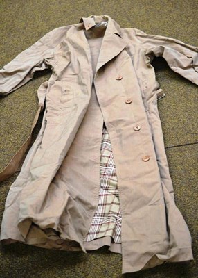 Lot 238 - A Burberry canvas raincoat with checked lining in original cardboard Burberry box with receipt...