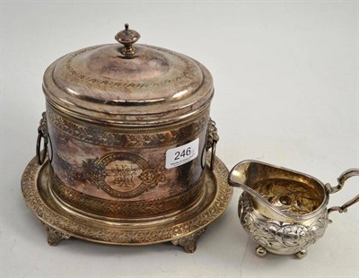 Lot 246 - A silver plated oval biscuit barrel and stand and a Georgian silver cream jug