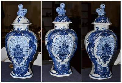 Lot 254 - Garniture of three 18th century style Delft vases and covers