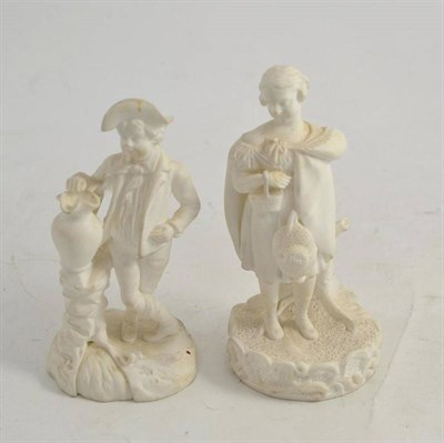 Lot 260 - Two biscuit figures of a boy and girl, height 14cm