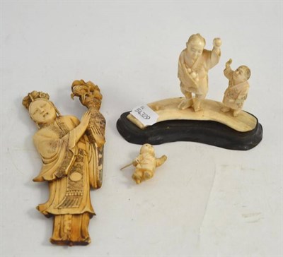 Lot 269 - Japanese ivory figure and an ivory figural group of three