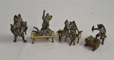 Lot 294 - A family of five cold painted bronze cats including three groups (5)
