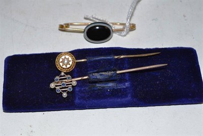 Lot 297 - A sardonyx brooch, a sapphire and seed pearl stick pin and a diamond set stick pin