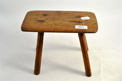 Lot 301 - An elm milking stool