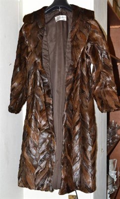 Lot 320 - A seal skin coat and fur