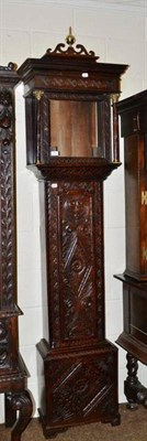 Lot 379 - A carved oak clock case