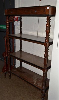 Lot 382 - A Victorian rosewood four tier buffet with frieze drawer (split to top)