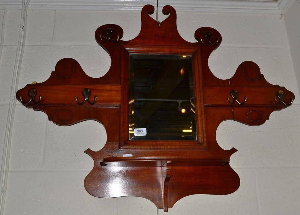 Lot 383 - A shaped mahogany hall mirror/coat stand