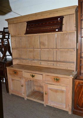 Lot 388 - A Victorian pine dresser with rack