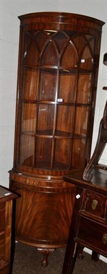 Lot 391 - A reproduction glazed bow fronted corner cabinet