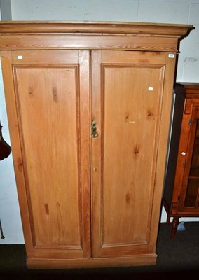 Lot 394 - A pine double wardrobe