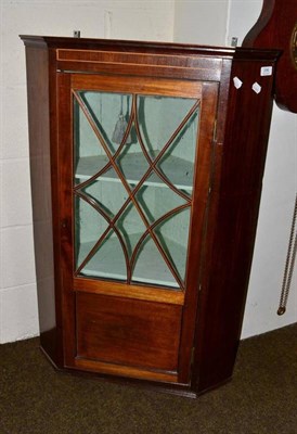 Lot 396 - A mahogany corner cupboard