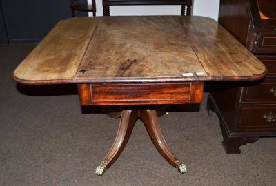Lot 420 - A Regency mahogany Pembroke table (top faded and split)