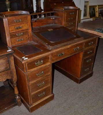 Lot 423 - An Edwardian oak writing desk