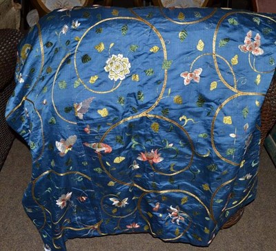 Lot 426 - Blue silk panel embroidered with floral motifs and butterflies