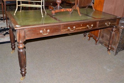 Lot 452 - A 20th century mahogany library table in William IV style with six drawers and leather top