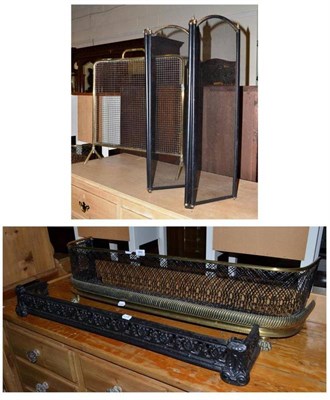 Lot 464 - A Victorian brass fender, another, a spark guard and a four panel fire screen