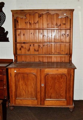 Lot 472 - A Victorian pine cupboard with later dresser rack