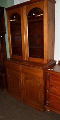 Lot 474 - Victorian pine bookcase with two glazed doors above two drawers and a cupboard