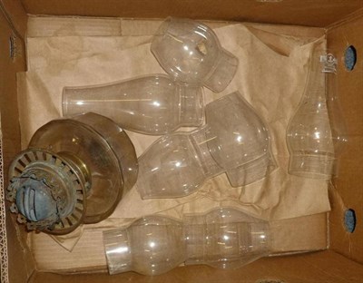 Lot 569 - A quantity of oil lamp parts including burners and shades