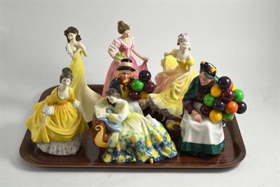 Lot 9 - A tray of seven Royal Doulton figures including 'Solitude' and 'The Old Balloon Seller'