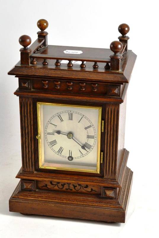 Lot 17 - An Edwardian oak mantel clock