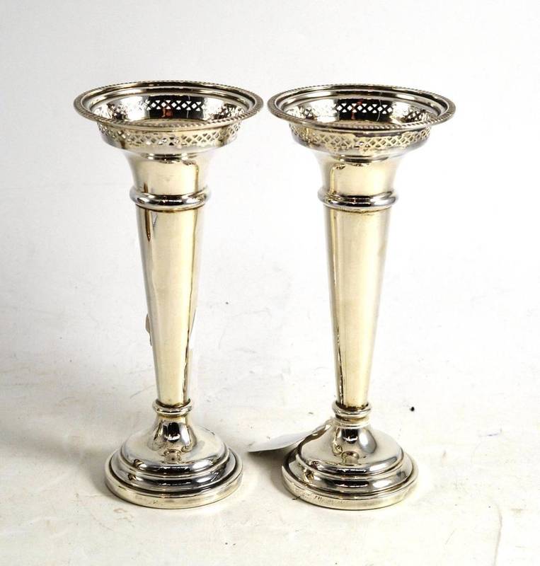 Lot 51 - A pair of loaded silver vases