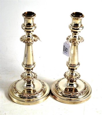 Lot 52 - A pair of electroplate candlesticks