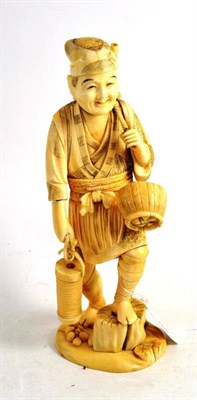 Lot 55 - A Japanese walrus ivory sectional figure of a fisherman with lantern, circa 1910 (small part of...