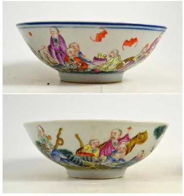 Lot 62 - A matched pair of Chinese porcelain bowls, bear Qianlong reign marks, painted in famille rose...