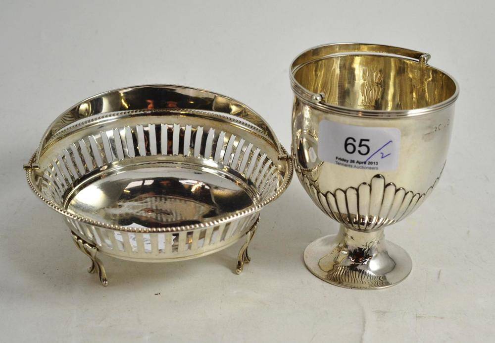 Lot 65 - Georgian silver vase with swing handle and a pierced silver basket with handle