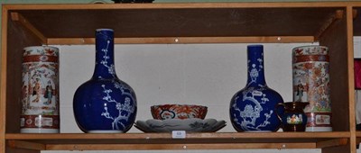 Lot 69 - A Japanese Imari charger and small bowl, a pair of beaker vases and three Chinese blue and...