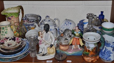 Lot 83 - A shelf of decorative ceramics including a Rockingham saucer, Mason's blue and white jug, Uncle...