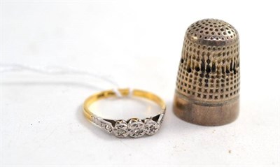 Lot 101 - A silver thimble by Charles Horner, and a diamond three stone ring stamped '18CT' and 'PLAT'