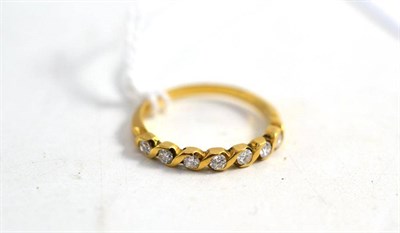 Lot 108 - An 18ct gold seven stone diamond ring