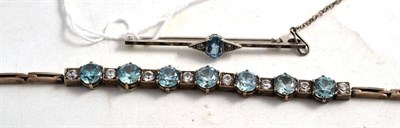 Lot 117 - A zircon line bracelet and a bar brooch stamped '9CT' (2)