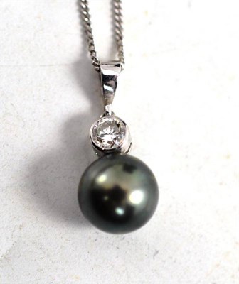 Lot 125 - A cultured pearl and diamond pendant on chain