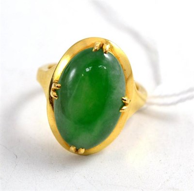 Lot 128 - A jade set ring, stamped '18CT'