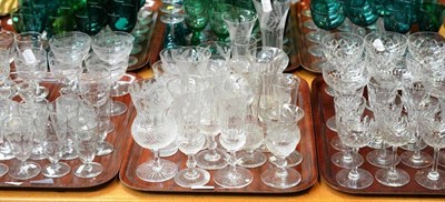 Lot 153 - Three trays of clear cut glass table ware including a composite part set of thistle etched and...