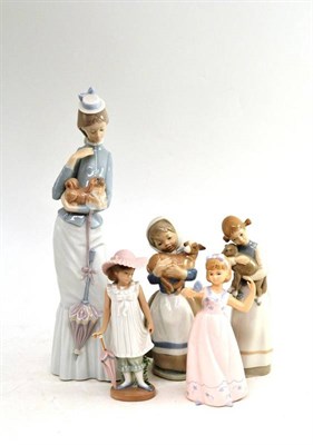 Lot 164 - Two Lladro figures, a similar figure and two Nao figures