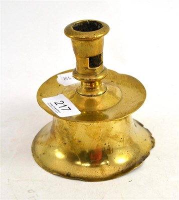 Lot 217 - Early brass squat candlestick with two ejection apertures