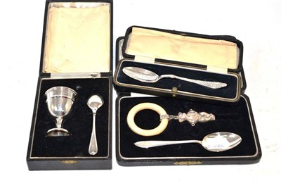 Lot 227 - Christening egg cup and spoon, a rattle, a spoon and a cased spoon