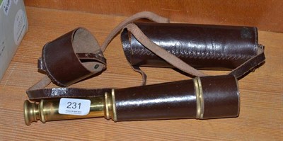 Lot 231 - A brass three draw telescope with leather sleeve and case
